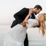 affectionate-wedding-couple-going-to-kiss-on-beach-5NLGSLQ.jpg