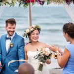 young-couple-in-a-wedding-ceremony-at-the-beach-7BG3HT5.jpg